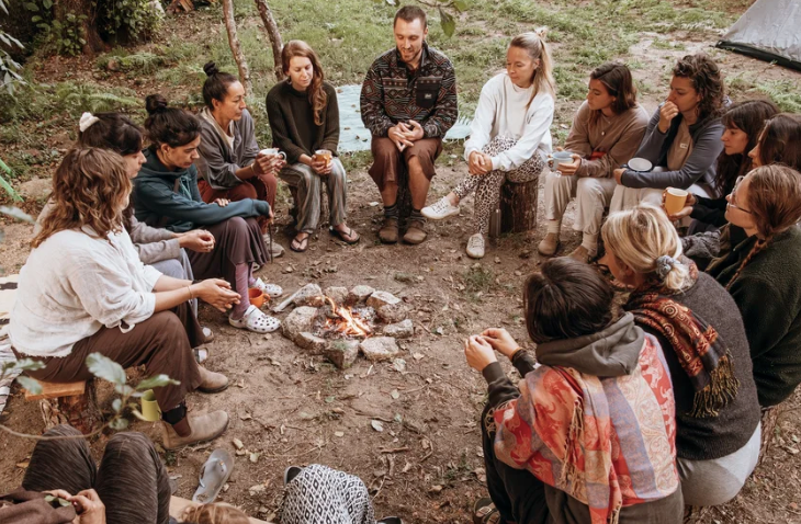 The tribe - people sitting around a bonfire